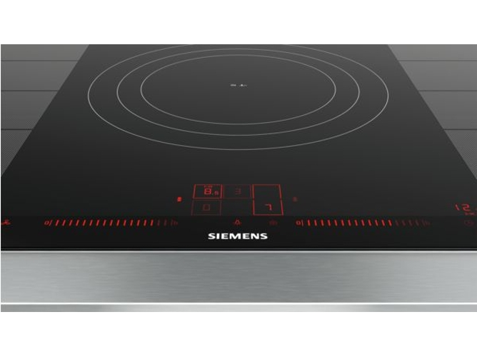 Placa de inducción negra con pantalla digital roja y borde plateado. Logotipo Siemens en la parte inferior.