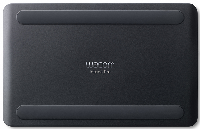 Underside of a black Wacom Intuos Pro tablet with rubber feet.