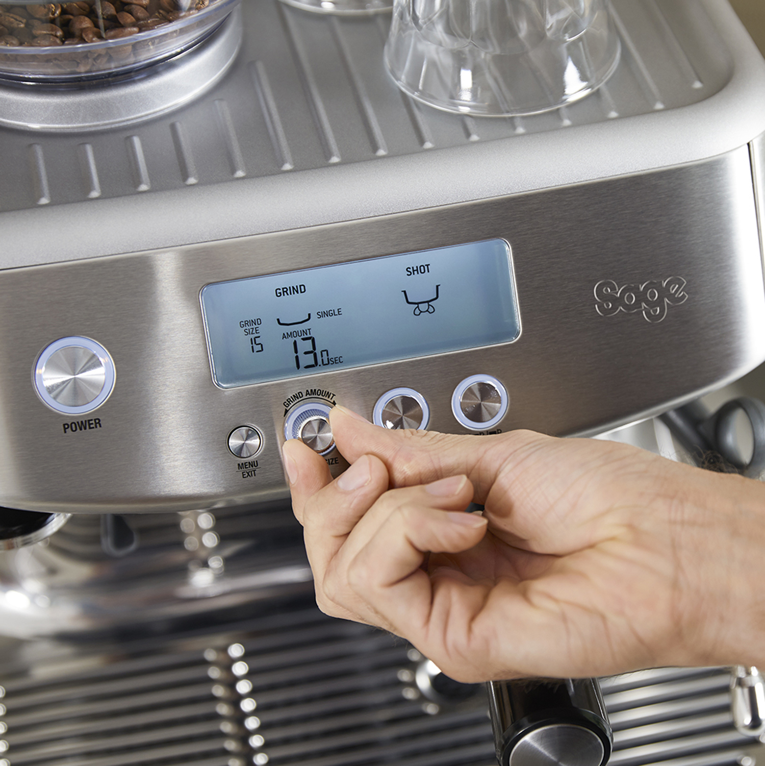 Coffee machine control panel with buttons and a dial.
