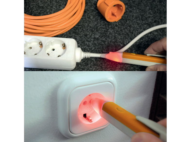 A narancssárga elektromos teszter világít a konnektor tesztelésekor.