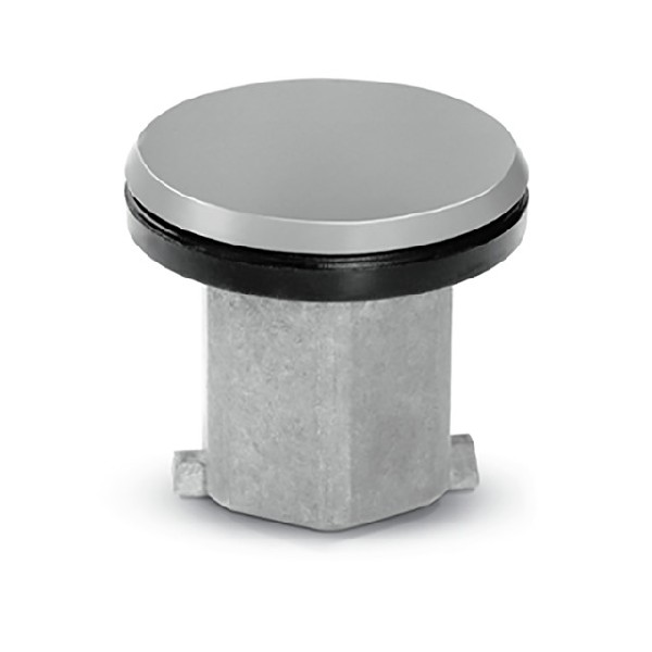 Tapón de desagüe plateado y negro. Parte superior circular, con base cuadrada.