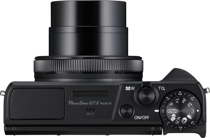 Draufsicht auf eine schwarze Kamera mit Objektiv. Sie hat Knöpfe, ein Rad und den Text 'PowerShot G7 X Mark III'.