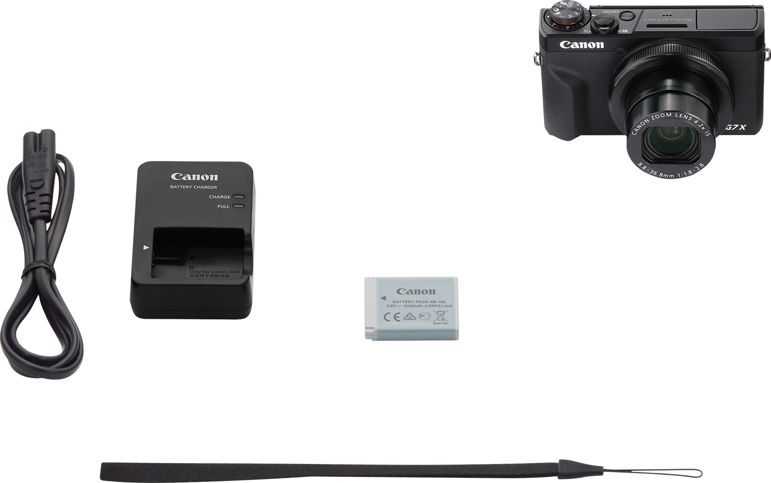 Canon camera kit op een zwart oppervlak. Inclusief camera, oplader, batterij en riem. Alle items op zwarte achtergrond.