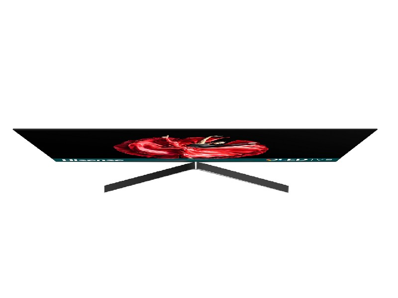 Vista superior de un televisor negro con un vestido rojo en la pantalla.