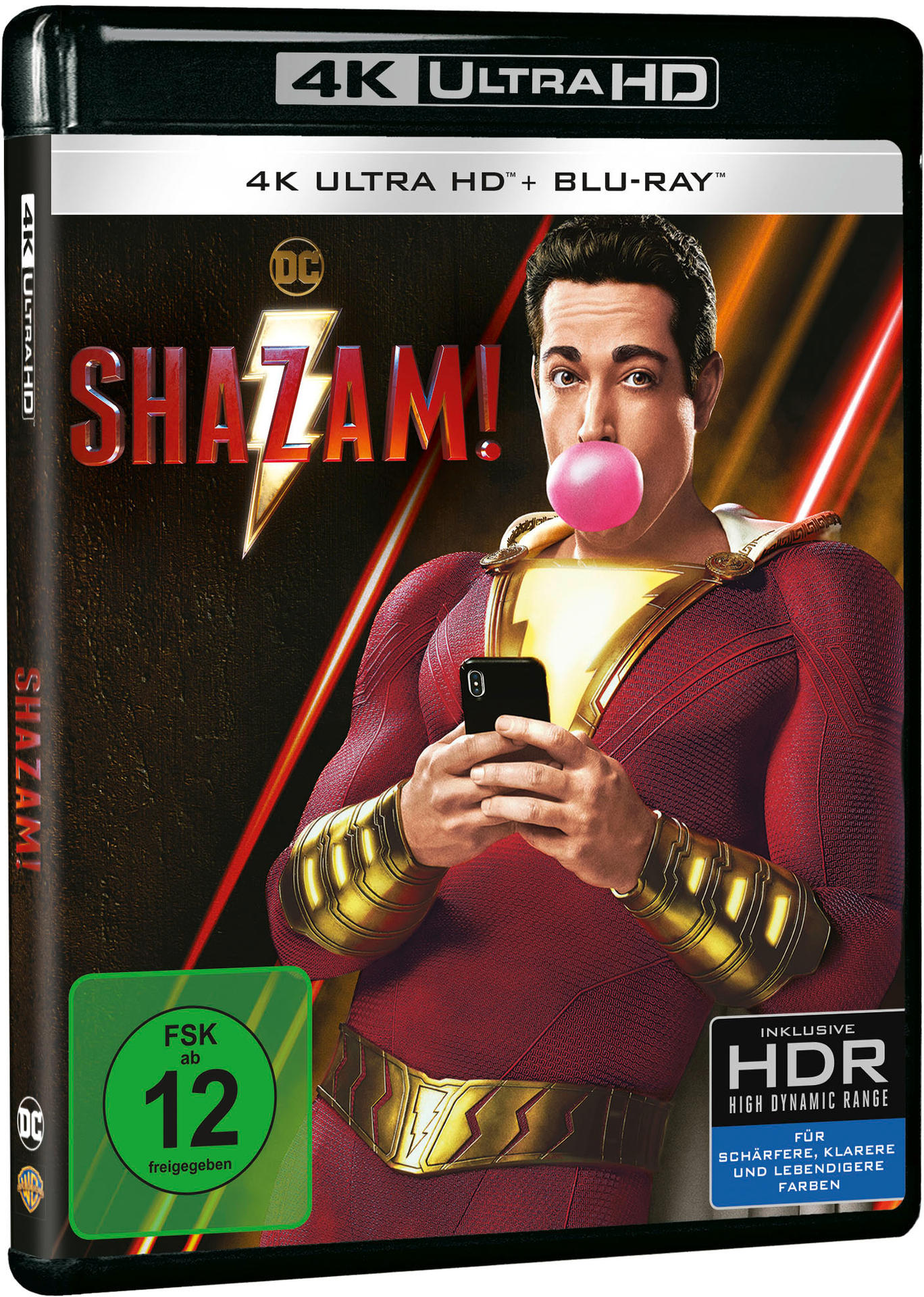Shazam! 4K Ultra HD Blu-ray Hülle. Mann im roten Anzug hält Telefon, bläst Kaugummi. Grünes Etikett.
