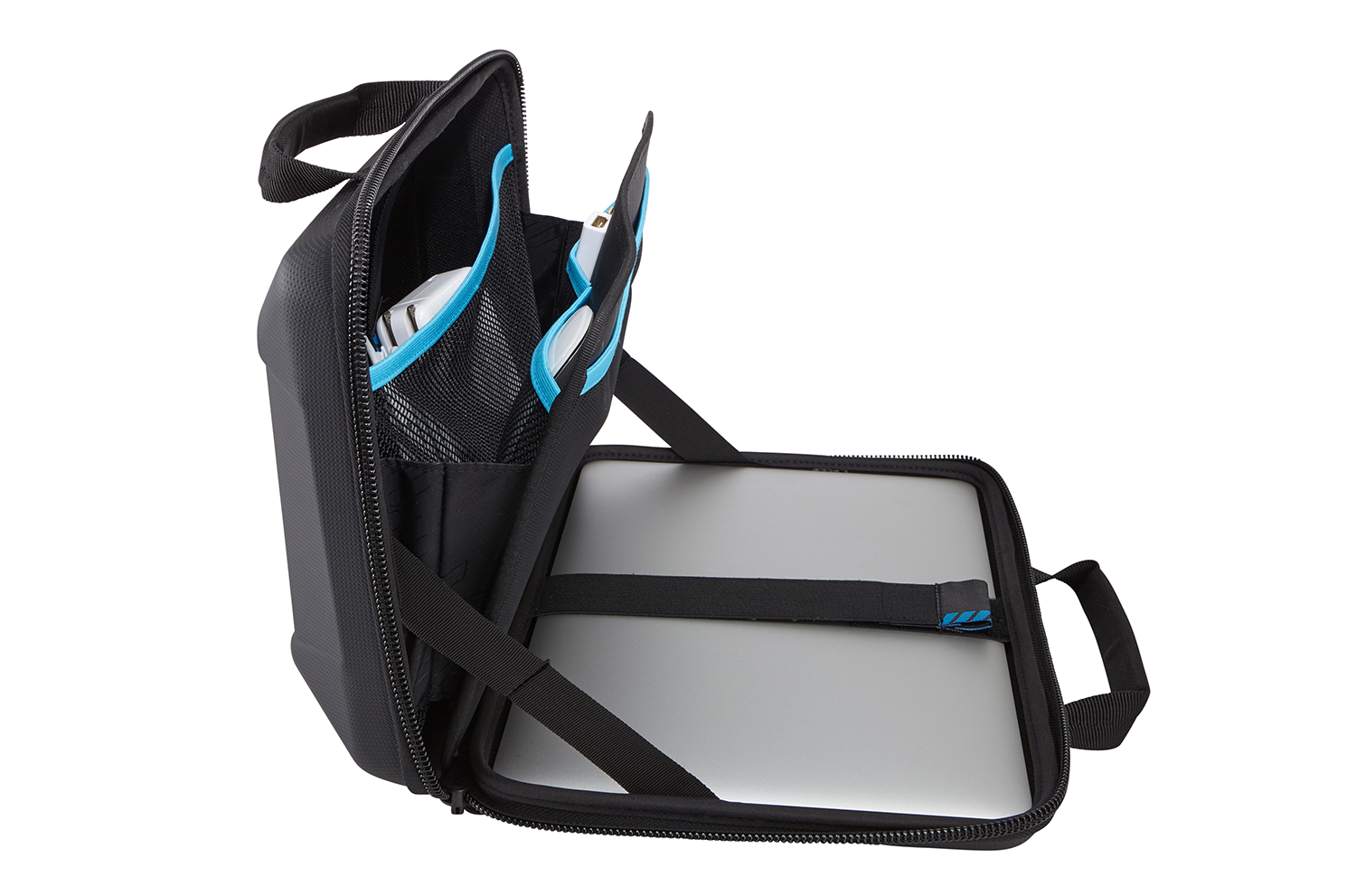Open black travel bag with laptop, white glasses, and other items.