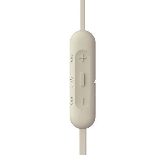Primer plano de una unidad de control blanquecina con botones y cable.