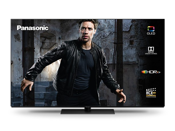 Un televisor OLED Panasonic negro grande, que muestra a un hombre. Se muestran Dolby, HDR y HCX.