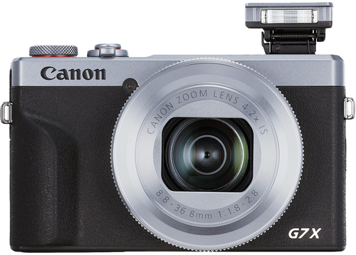 Canon G7 X kamera, ezüst és fekete, vakuval és objektívvel.