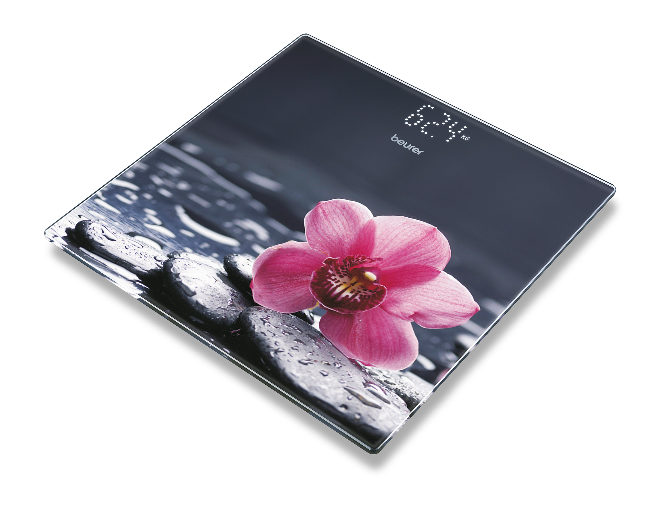 Schwarze Waage mit Blumen und digitaler Gewichtsanzeige.