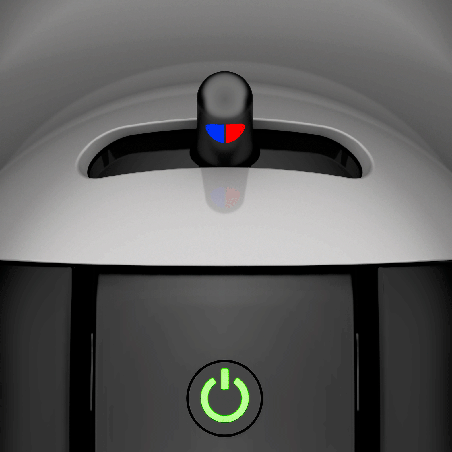 Close-up van een zwart-witte koffiemachine. Een groene aan/uit-knop brandt.