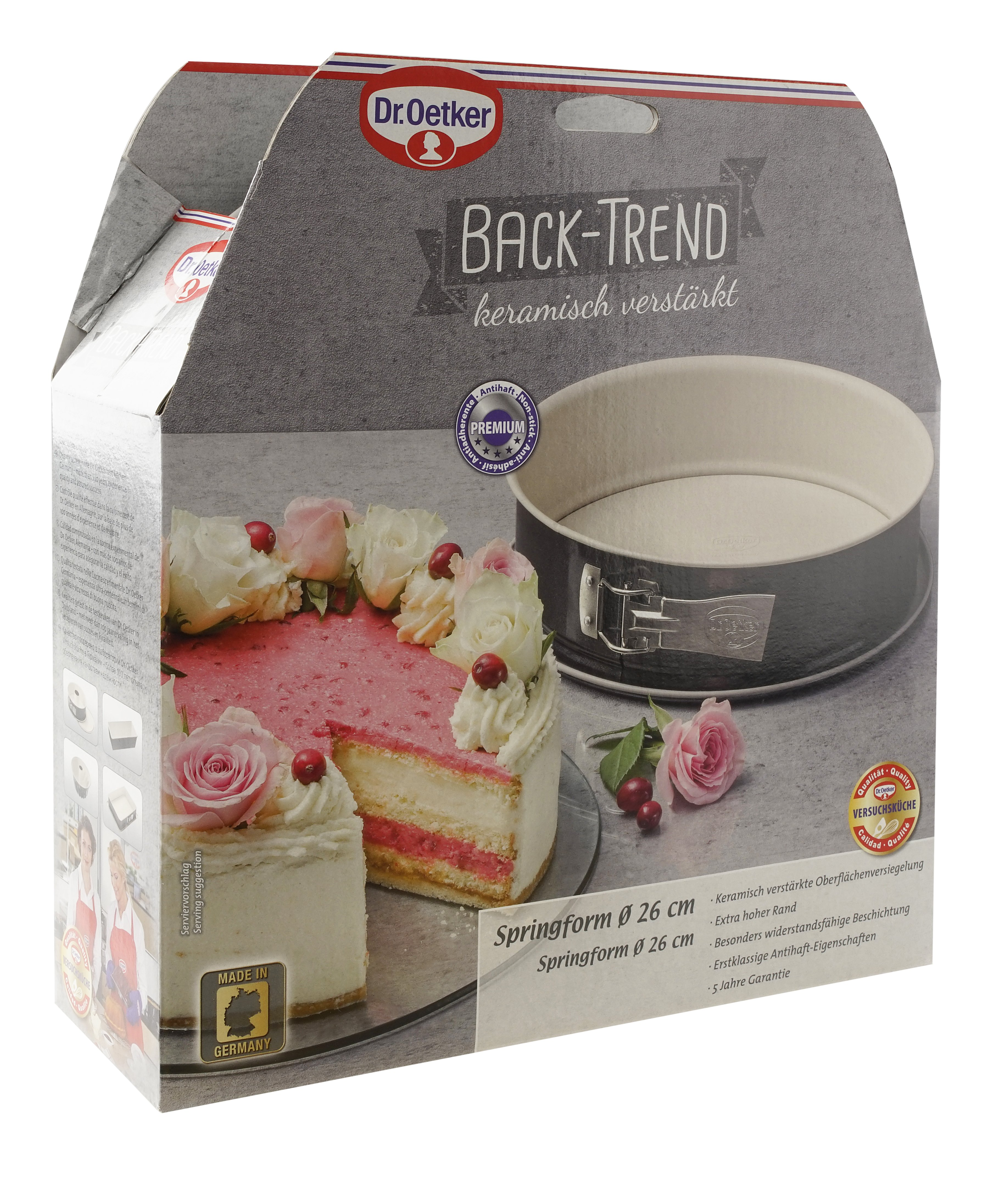Karton mit Tortenscheibe, Rosen und Springform. Grauer Hintergrund und Dr. Oetker Logo.