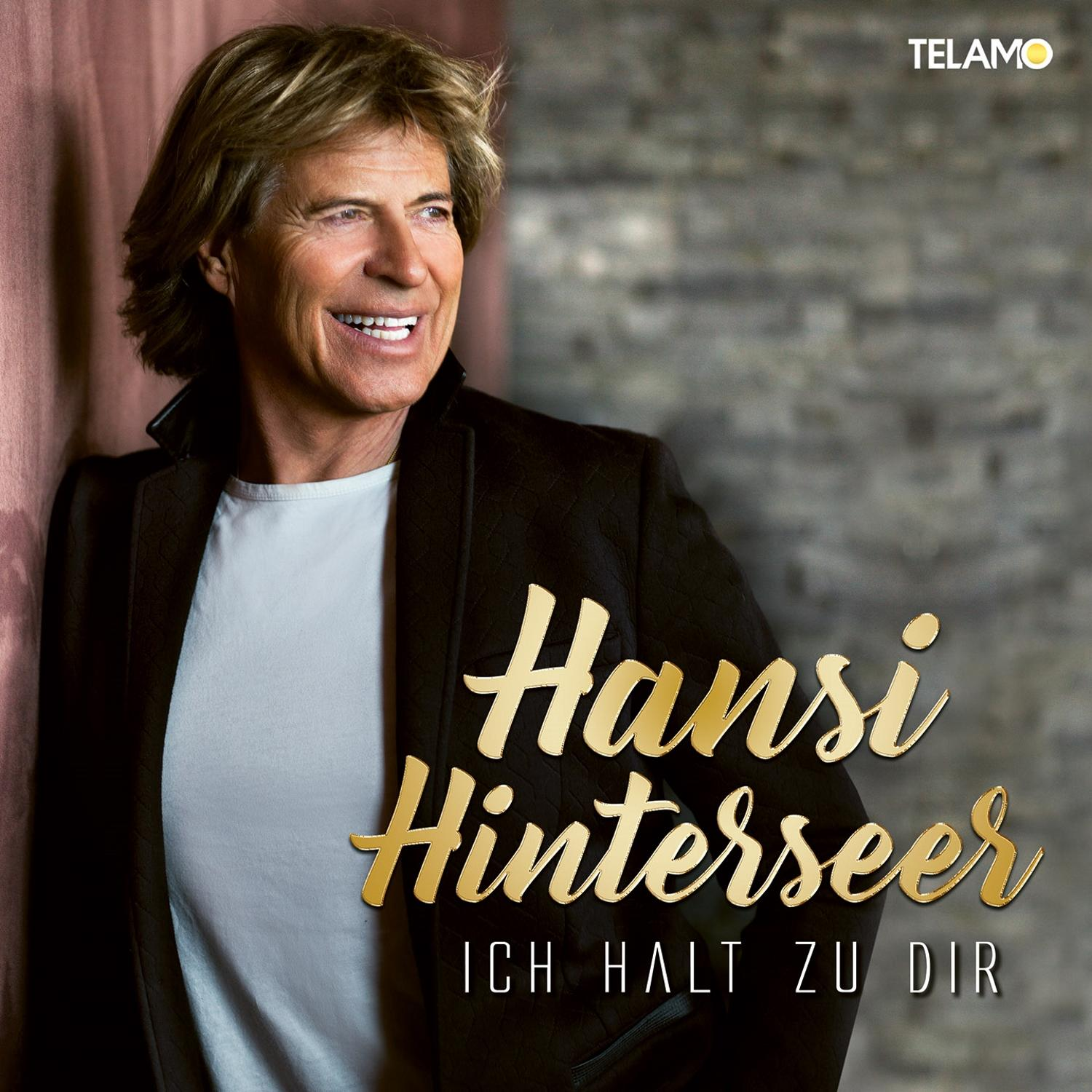 Albumcover von Hansi Hinterseer. Er lächelt und blickt zur Seite. Goldener Text.
