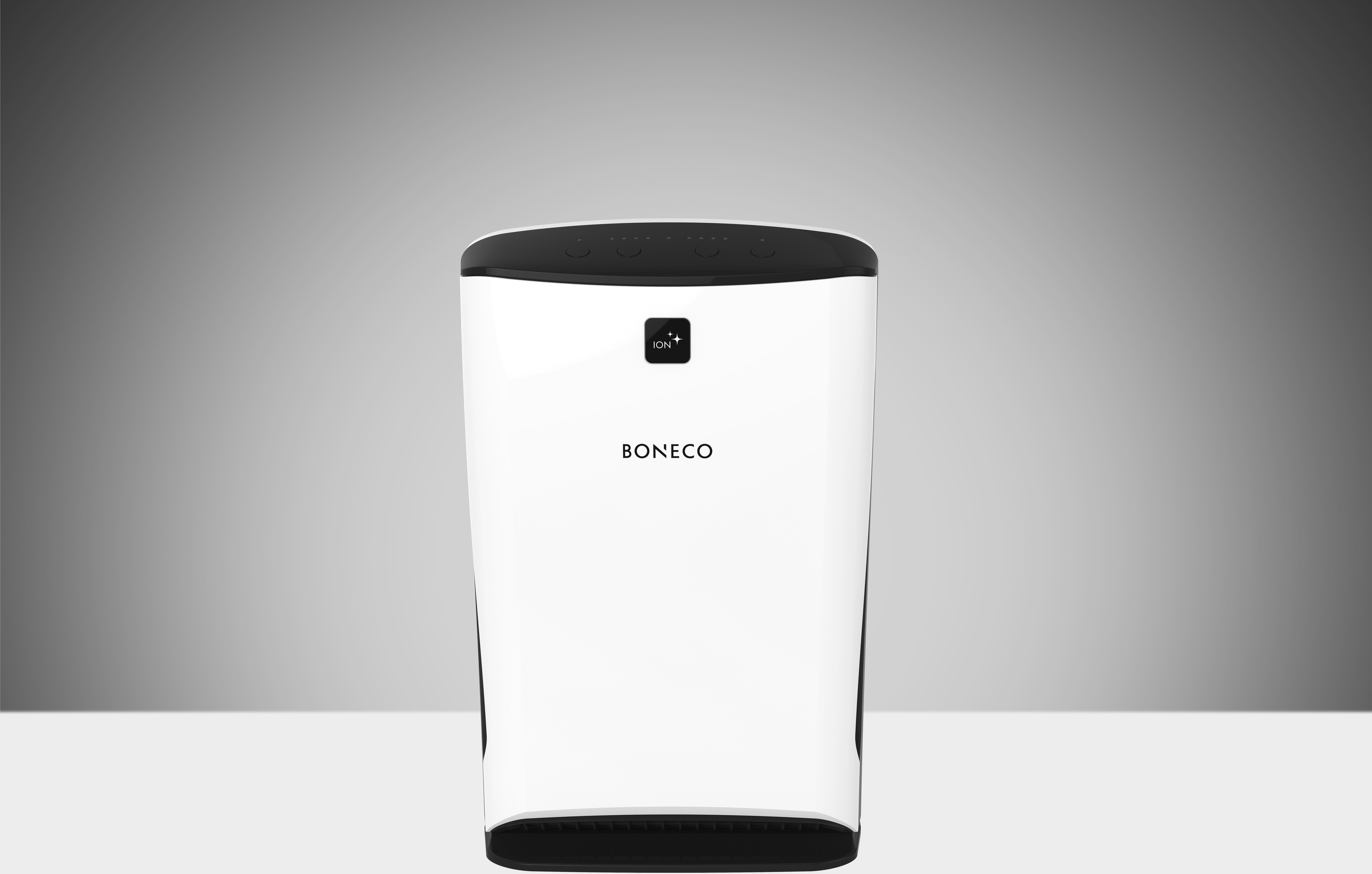 Ein weißer Luftreiniger mit dem Wort 'BONECO' auf der Vorderseite, auf einer weißen Oberfläche.
