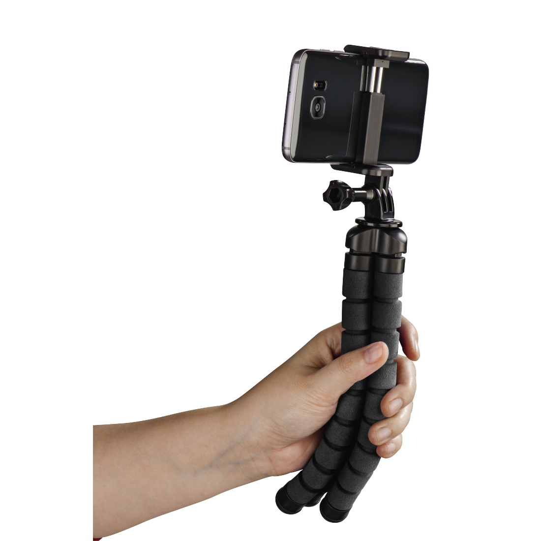 A hand holds a smartphone on a tripod. The background is black.