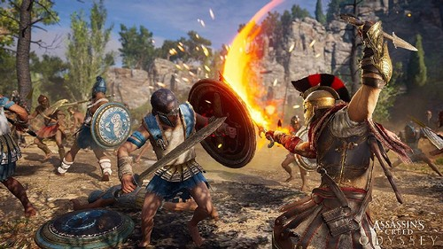 Escena de batalla de un juego con guerreros luchando, espadas y escudos. Efecto de fuego.