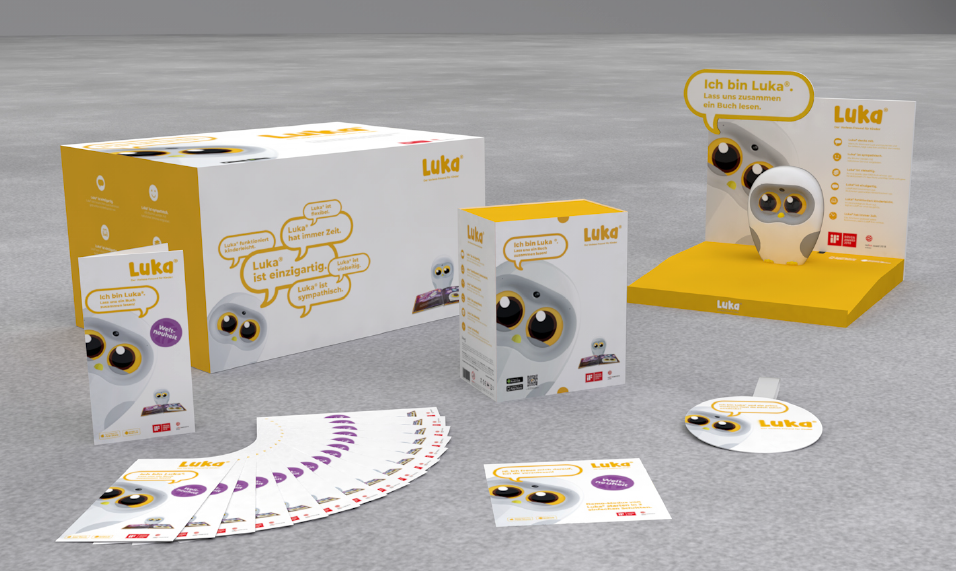 Luka Roboter-Spielzeug und zugehörige Verpackungs- und Werbematerialien.