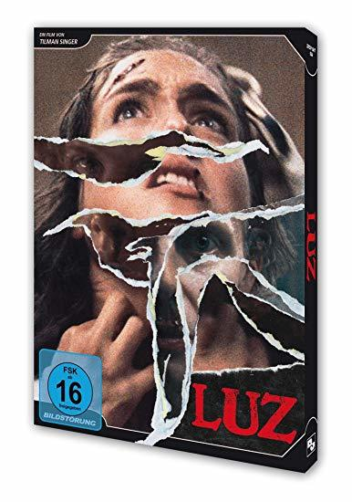 Filmcover mit zerrissenem Papier, das das Gesicht einer Frau freigibt. Der Titel 'LUZ' ist sichtbar.
