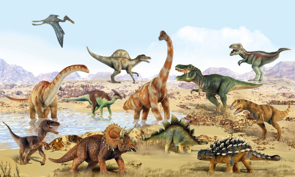 Verschiedene Dinosaurier-Modelle in einer Landschaft. Ein Pterodaktylus fliegt am Himmel.