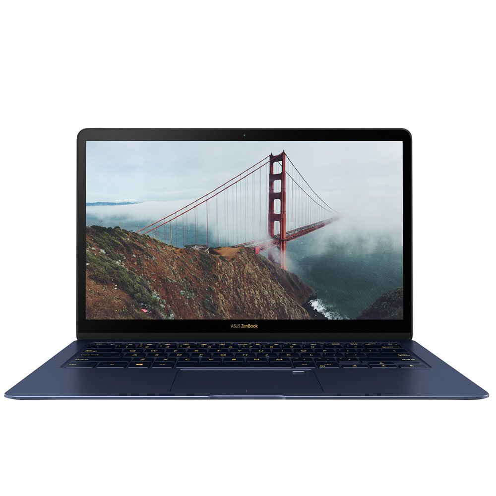 Una laptop azul, la pantalla muestra el puente Golden Gate en la niebla, contra blanco.