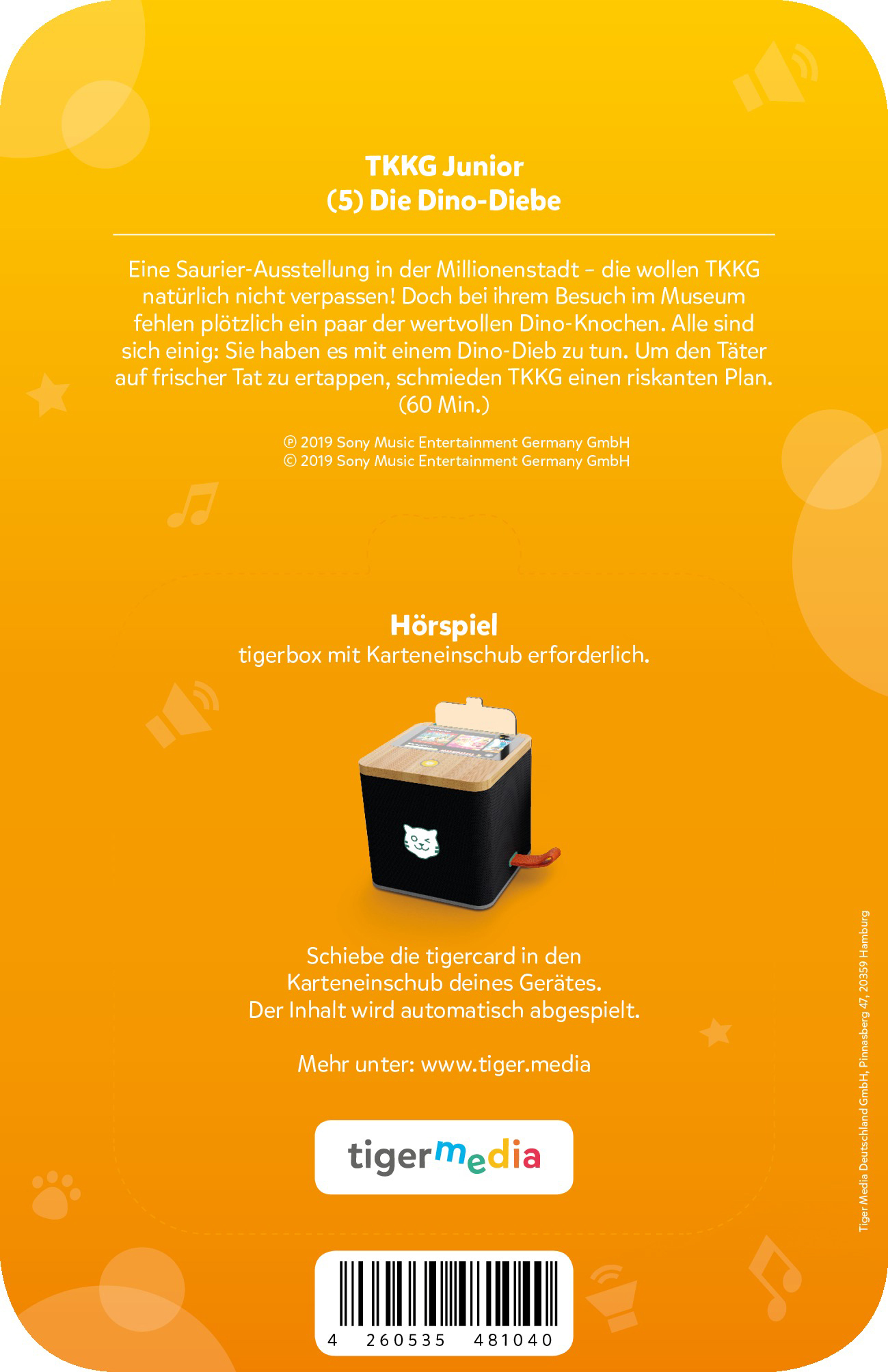 TKKG Junior Hörspiel: Dino-Diebe. Ein schwarzer tigerbox mit Holzdeckel und Katzenlogo.