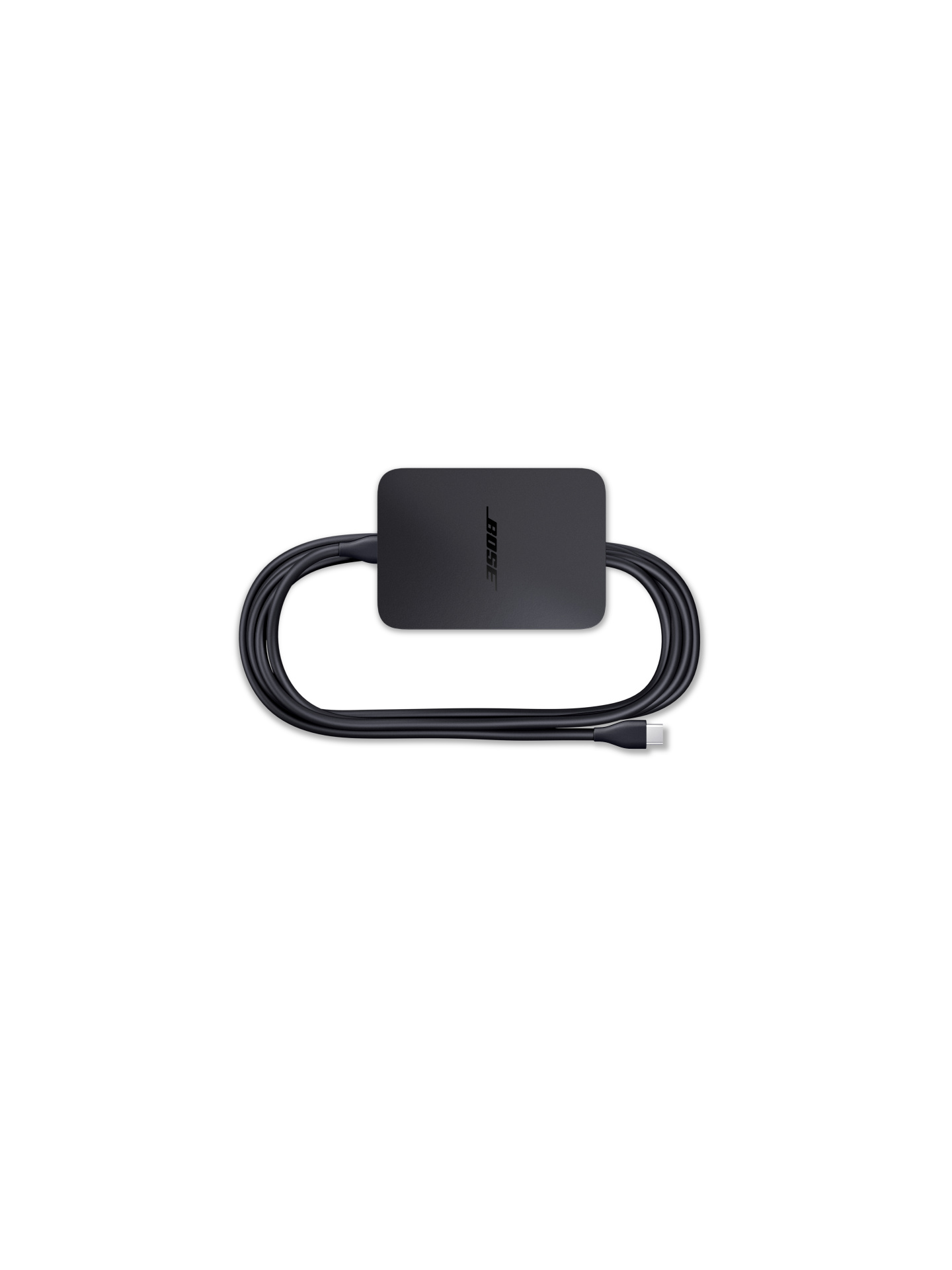 Schwarzes Bose-Gerät mit einem schwarzen Kabel, auf weißem Hintergrund.