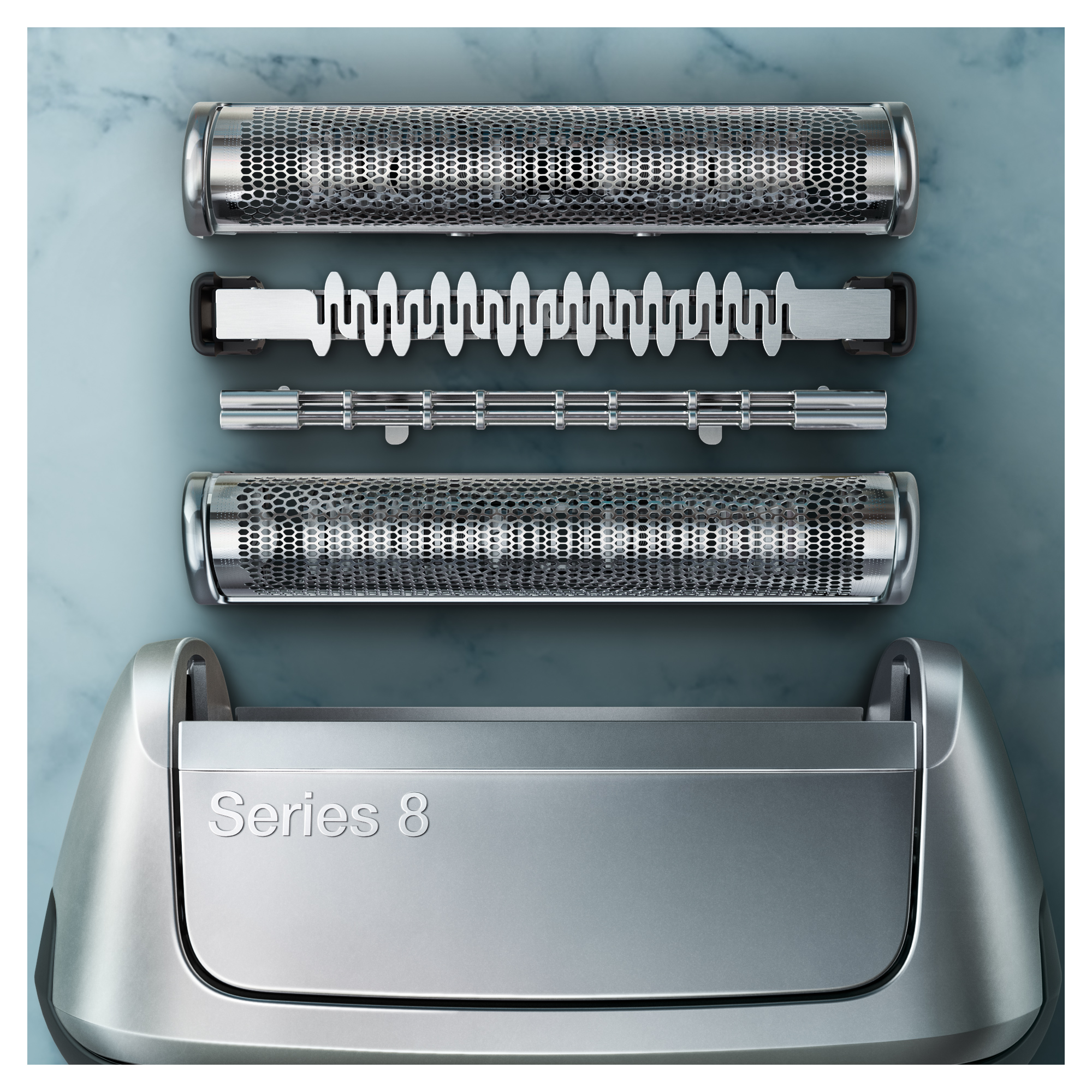Disassembled shaver parts, including blades and a frame, on a light blue surface.