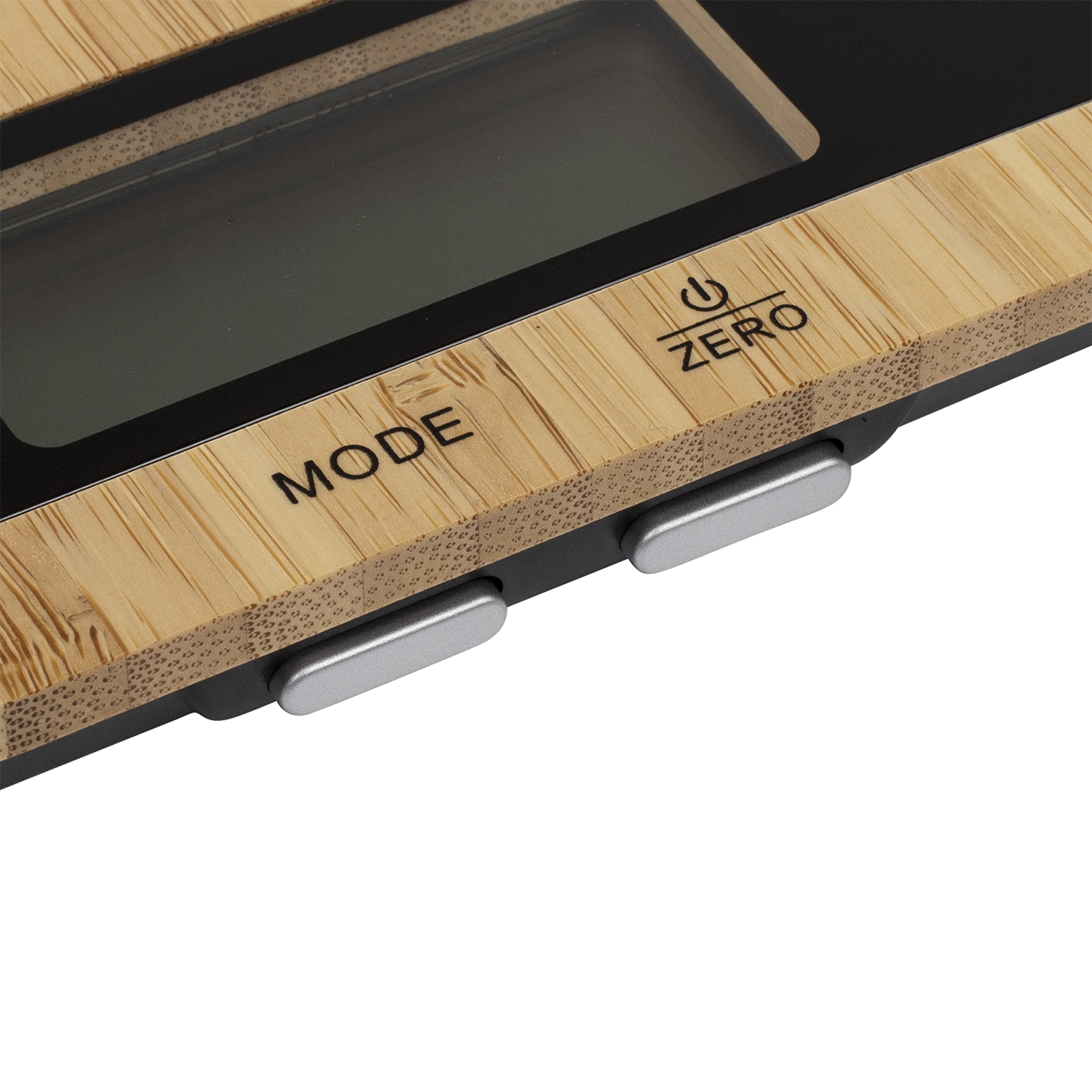 Close-up of a bamboo scale with buttons labeled 'MODE' and 'ZERO', showing a display.