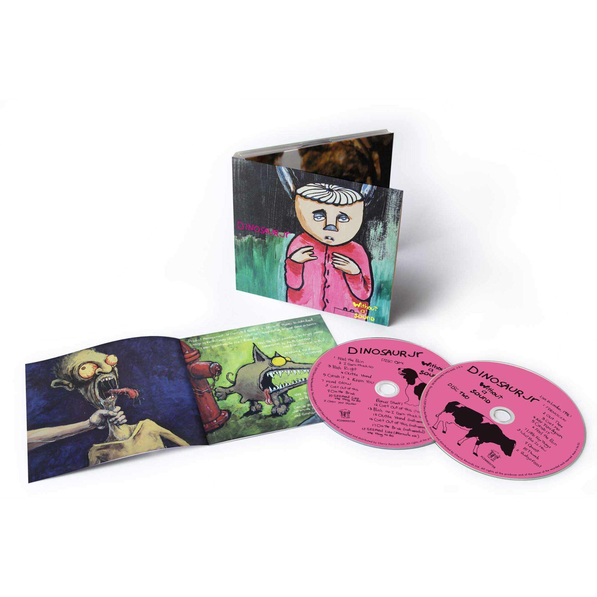 Geöffnete CD-Hülle mit zwei CDs und einem Booklet. Pinkfarbene CDs mit Text. Bunte Kunstwerke.