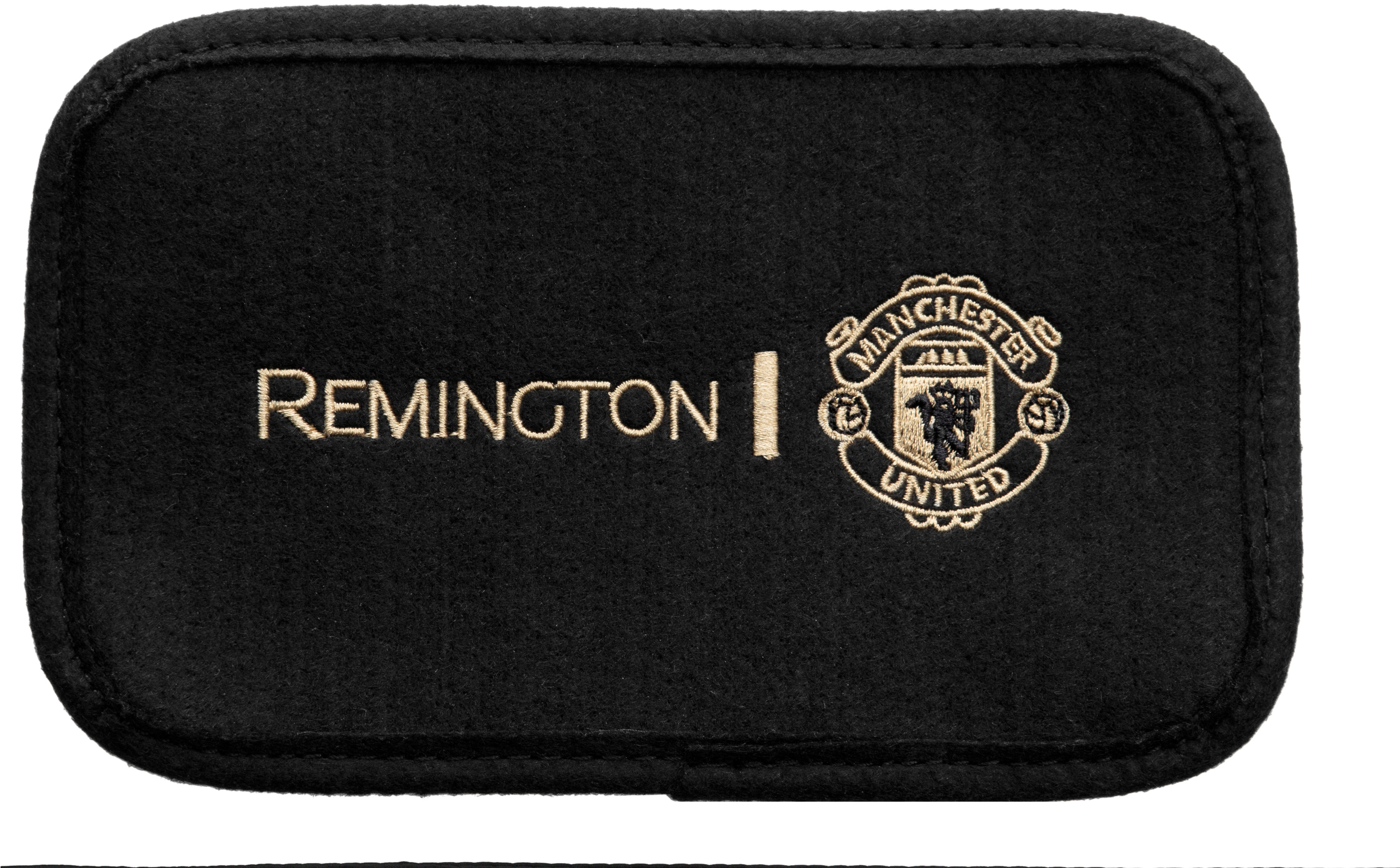 Schwarze Matte mit Remington-Logo und Manchester United-Logo.