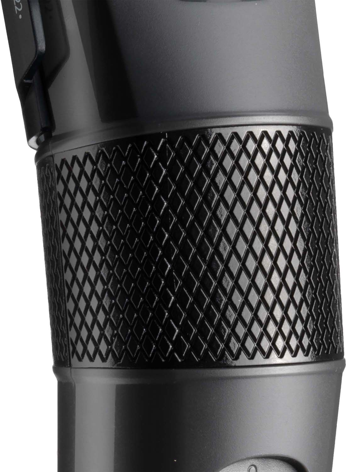 Close up of a black electric shaver handle with a textured grip. The grip has a diamond pattern.