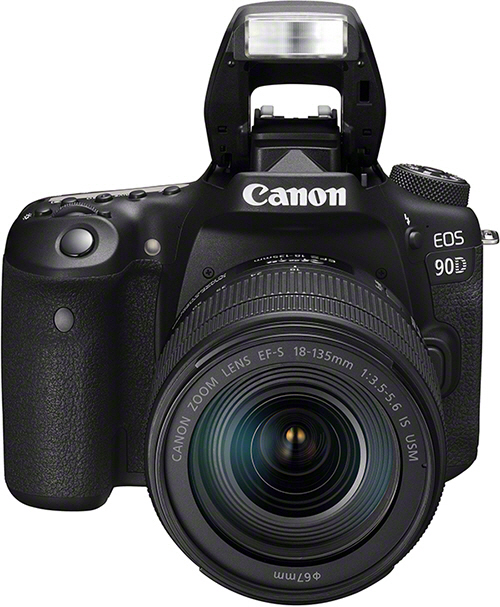 A black Canon EOS 90D camera with a lens and a pop-up flash. The camera has the Canon logo.