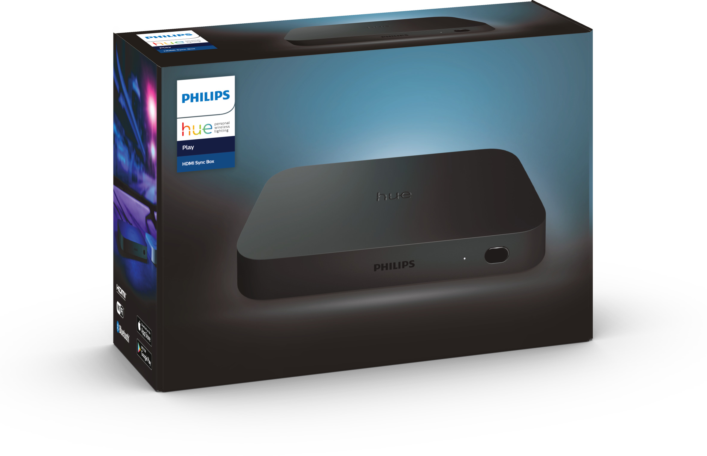 Eine Philips Hue Play HDMI Sync Box auf der Verpackung, mit einer schwarzen Box auf dem Tisch.