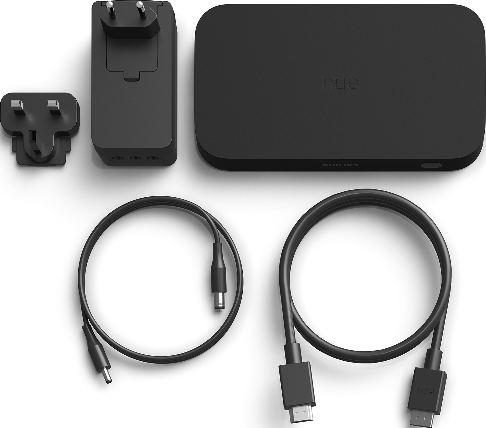 Schwarzes Philips Hue Smart Lighting Set: Bridge, Adapter, Kabel und Stecker.