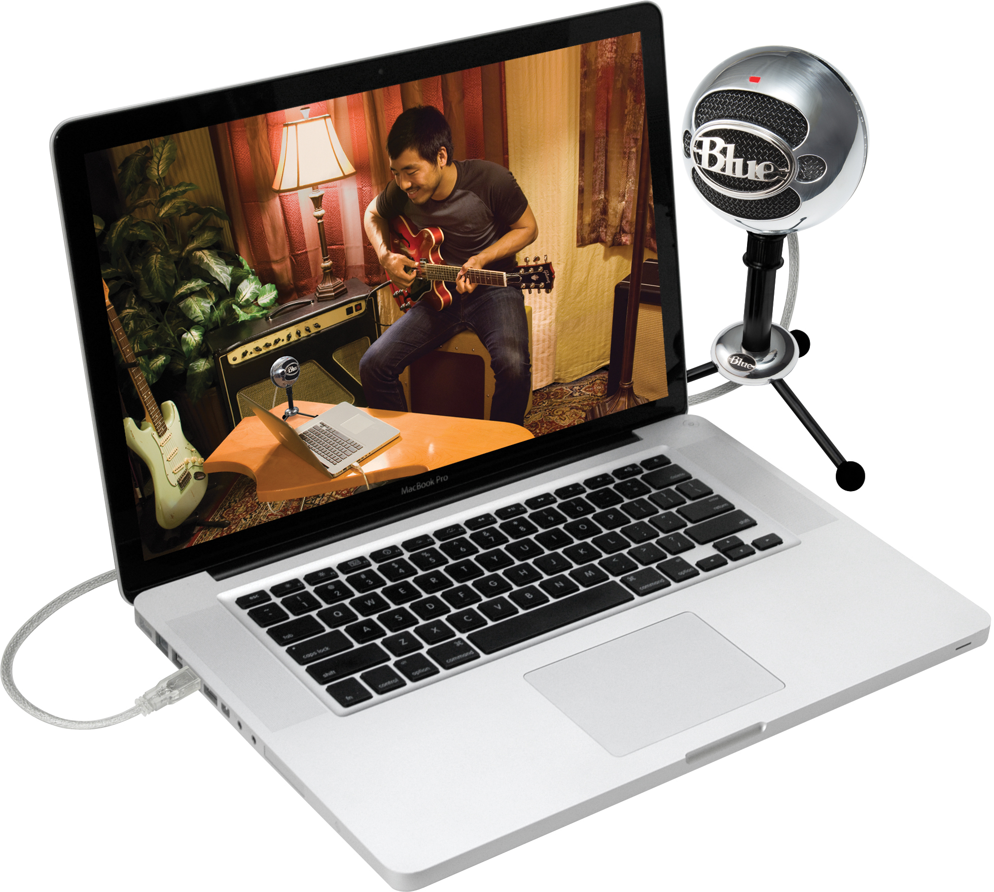 Laptop mit Gitarre spielender Person auf dem Bildschirm und Mikrofon.