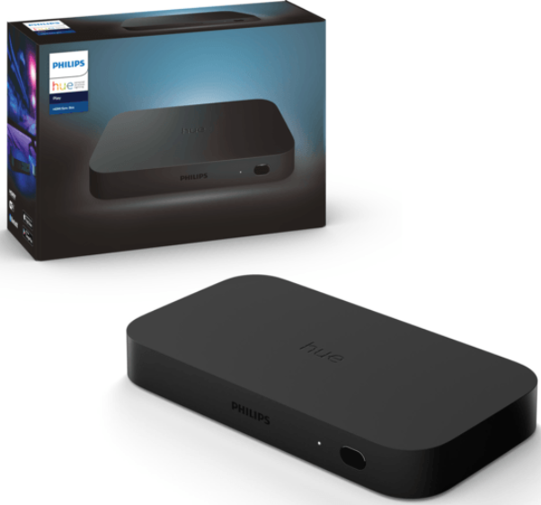 Schwarze Philips Hue Bridge und Box. Die Box hat das Produktbild und Logo. Die Bridge befindet sich auf einer weißen Oberfläche.