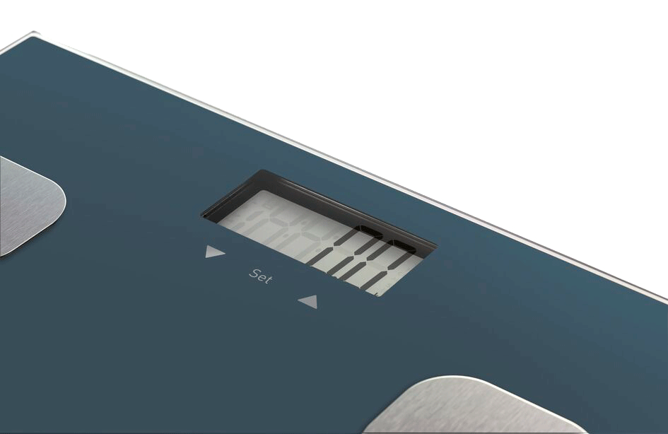Blue digital scale with a display. The display shows numbers. Dark background.