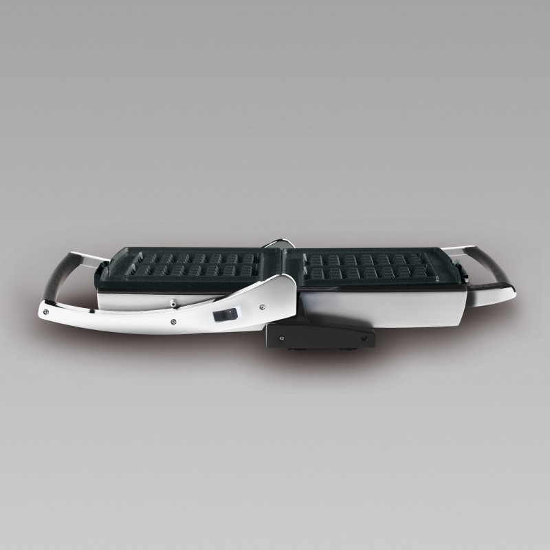 Waffle maker, open and viewed from above. Black interior with a silver frame.