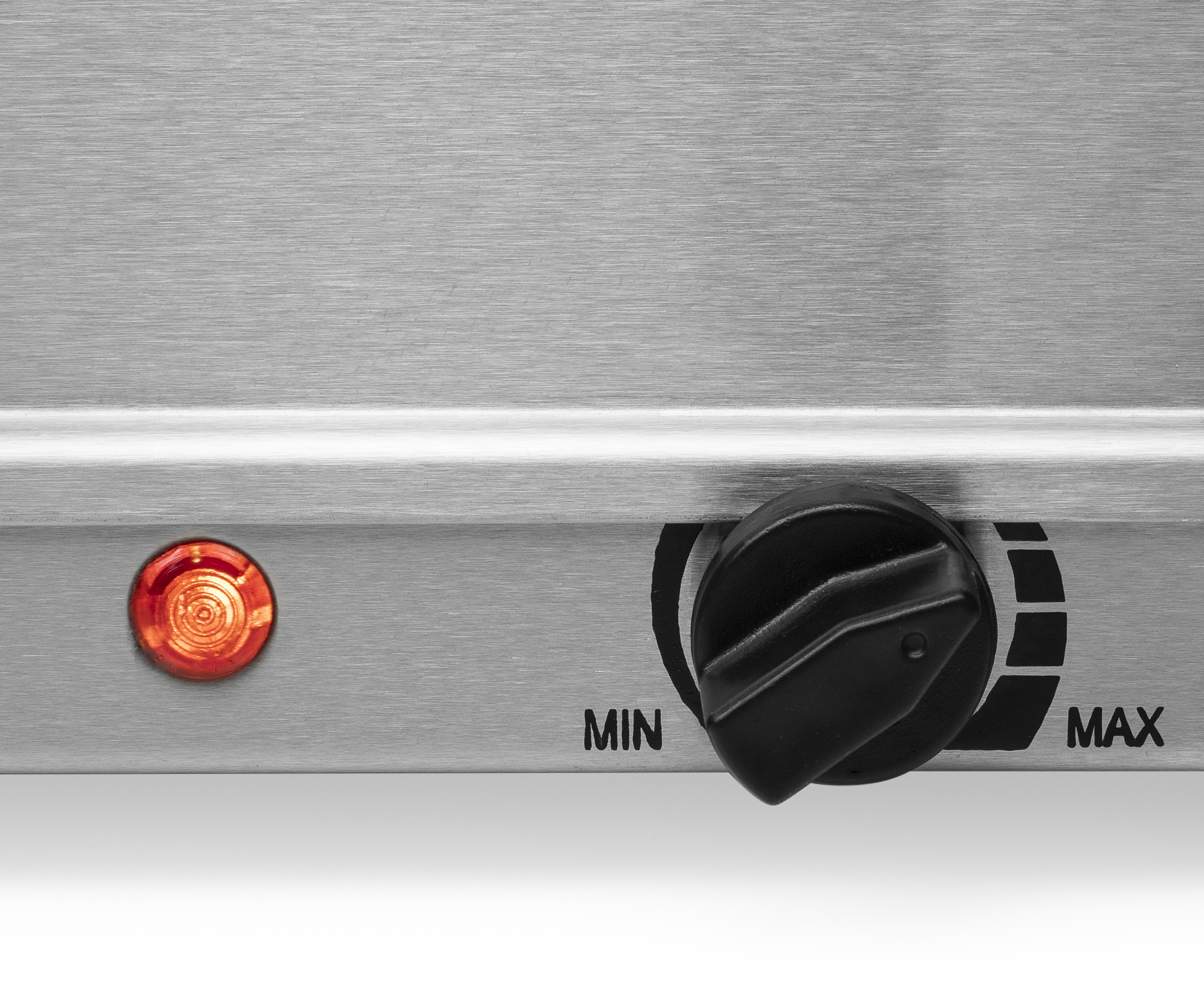 Close-up of a control panel with a red light and a knob labeled 'MIN' and 'MAX'.