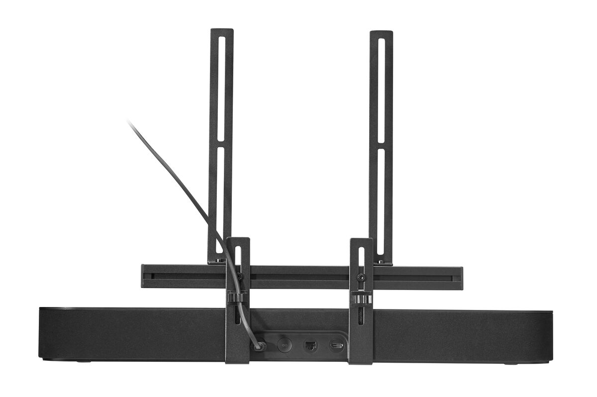 Schwarze Soundbar mit TV-Halterung, Kabeln und Anschlüssen, vor weißem Hintergrund.