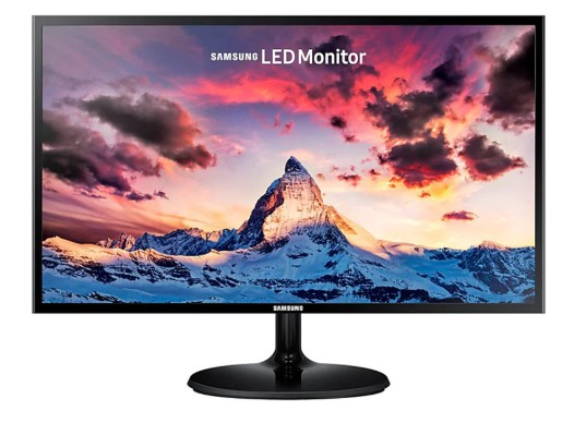 Un monitor de computadora que muestra una escena de montaña con cielo colorido.