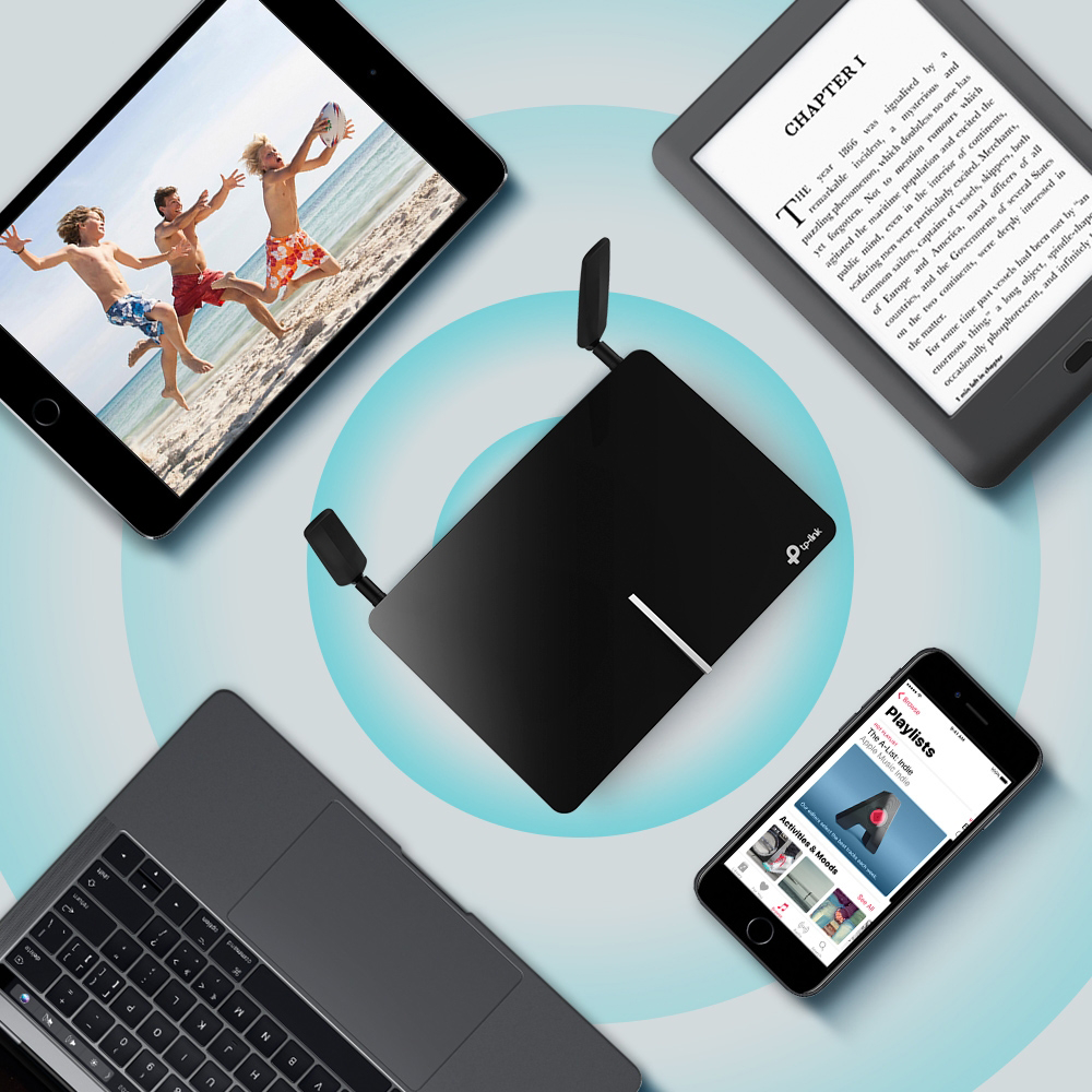 Router, tablet, laptop, and phone on a table. Tablet shows beach image, phone has playlist.