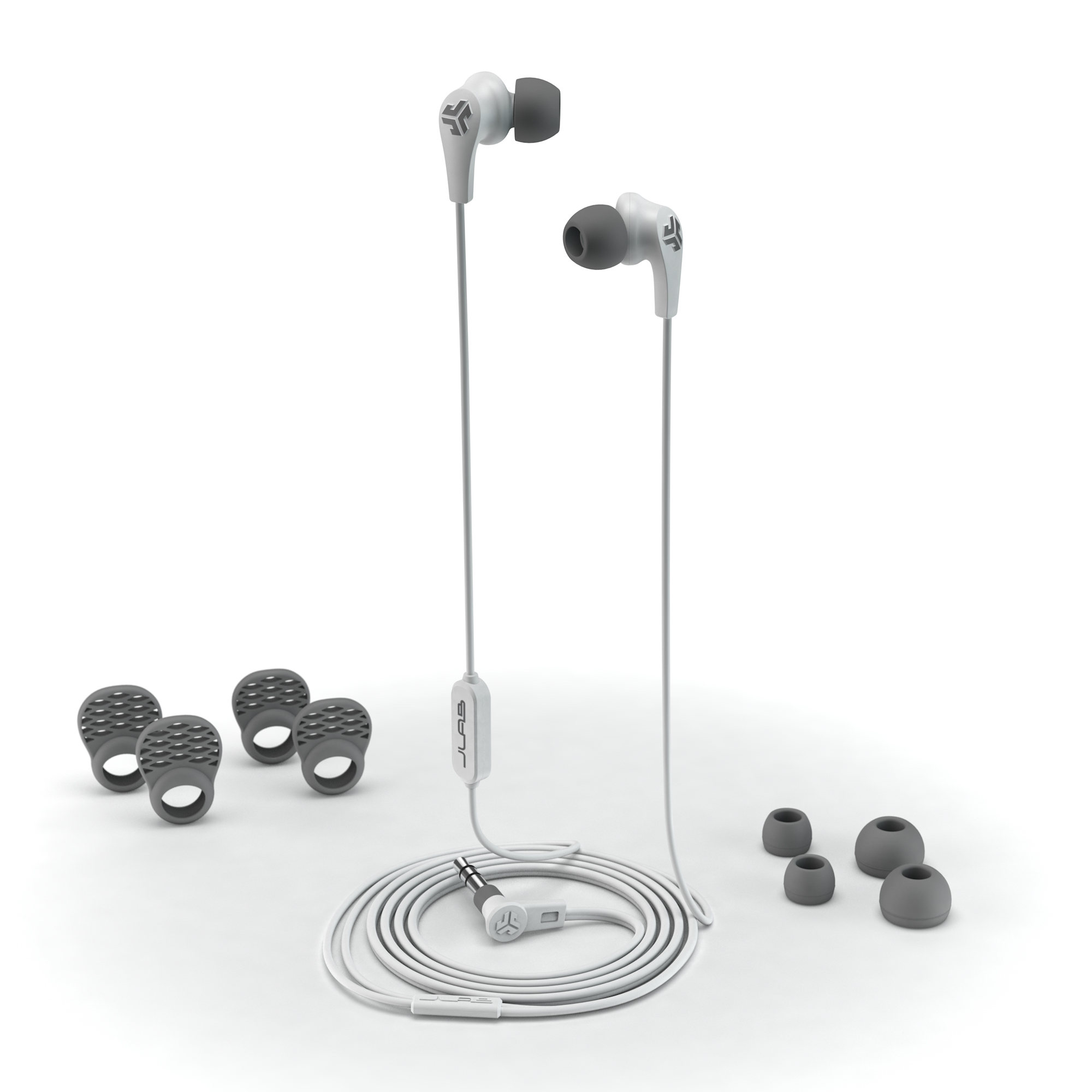 Weiße Ohrhörer mit zusätzlichen Ohrstöpseln. Die Ohrhörer haben ein weißes Kabel und Stecker.
