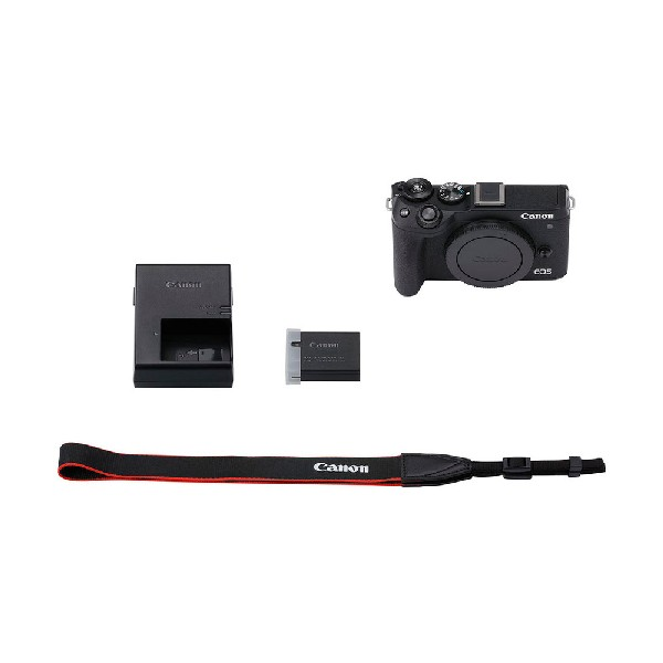 Kit de cámara Canon con cargador, batería y correa, todo sobre fondo blanco, color negro.