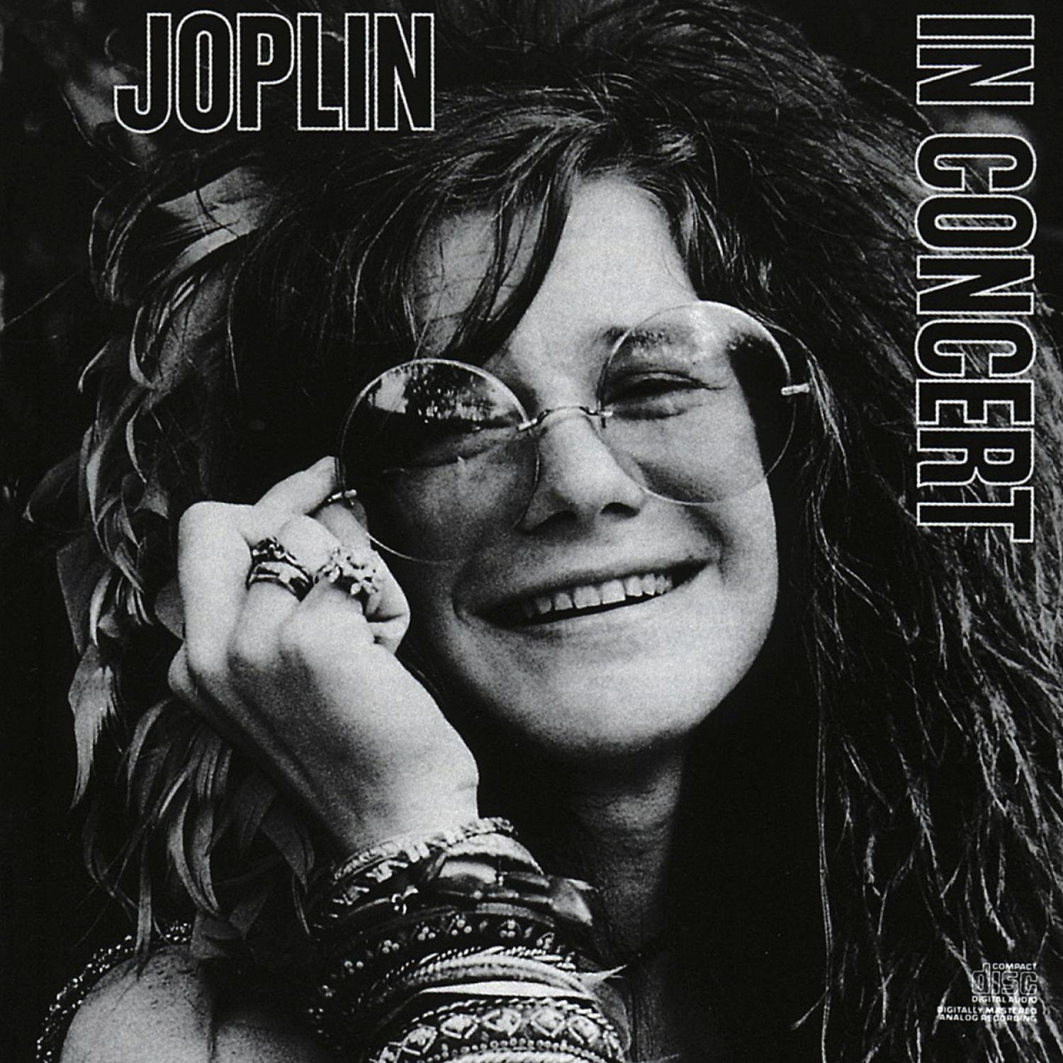 Albumcover von Janis Joplin, lächelnd und mit Sonnenbrille. Schwarz-Weiß-Foto.